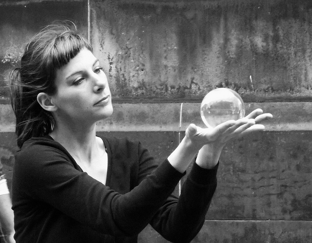 woman holding crystal sphere